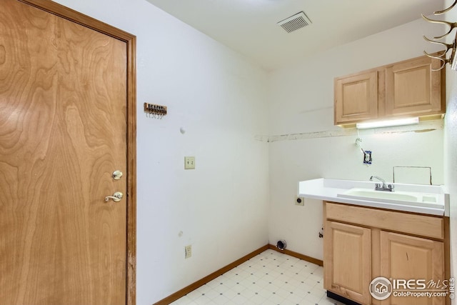 10947 W 100th Dr, Westminster, CO 80021 - laundry area featuring cabinet space, hookup for an electric dryer, and light floors