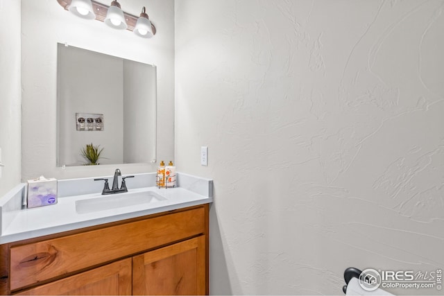 bathroom with vanity with extensive cabinet space