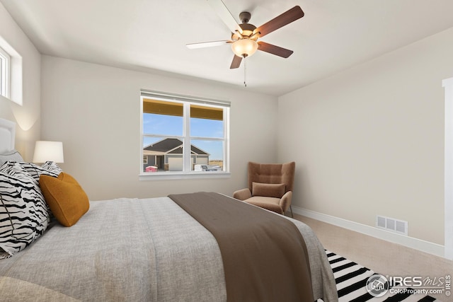 carpeted bedroom with ceiling fan