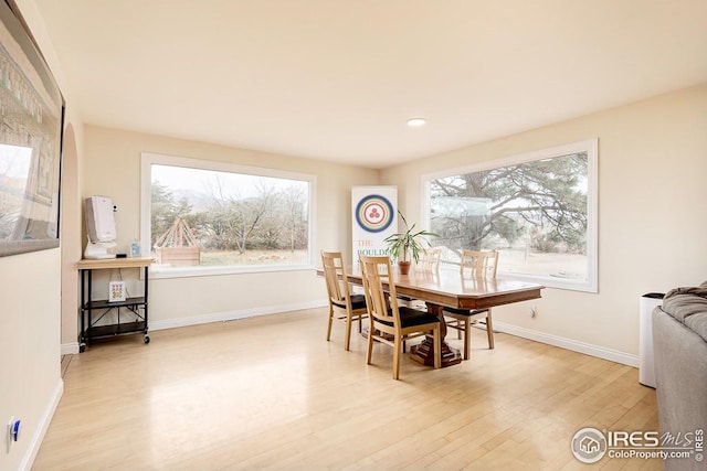 dining area featuring light wood-type flooring