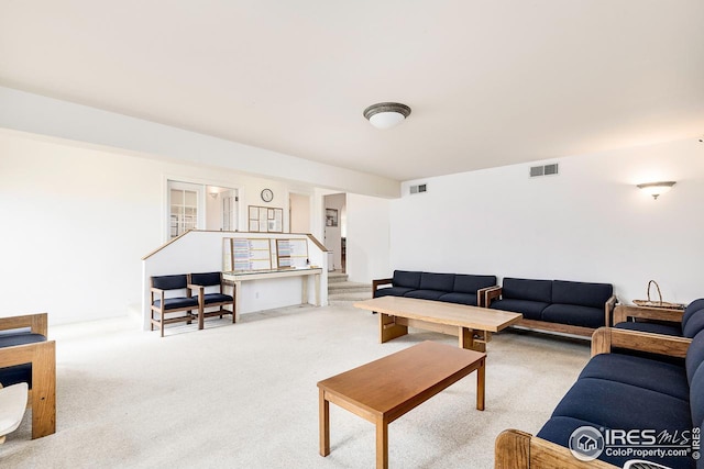 living room featuring light colored carpet