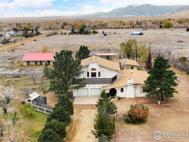 bird's eye view featuring a mountain view and a rural view