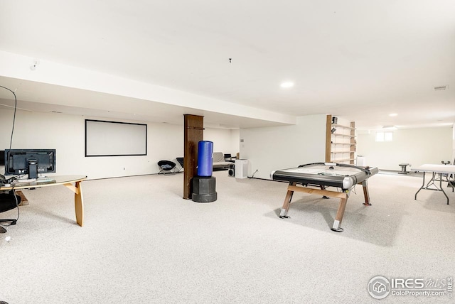 recreation room featuring light carpet