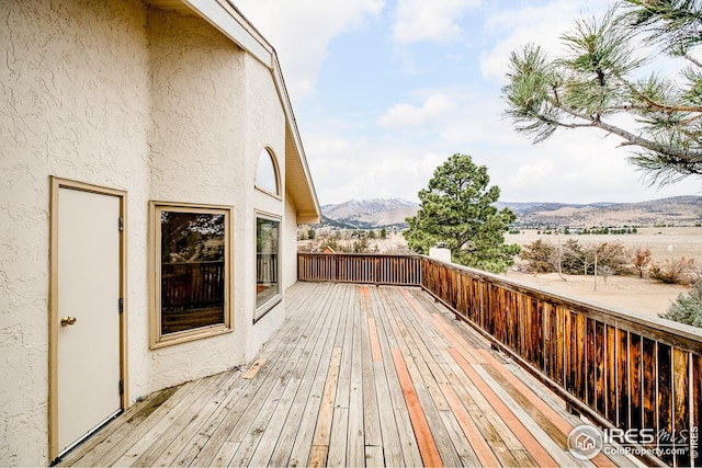 wooden terrace with a mountain view