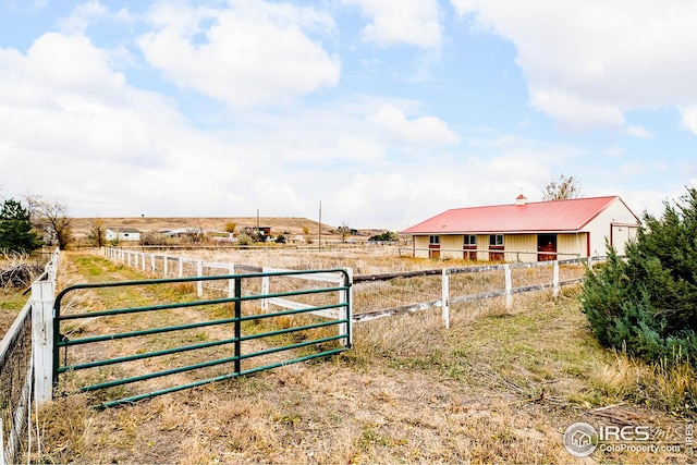 view of yard with a rural view