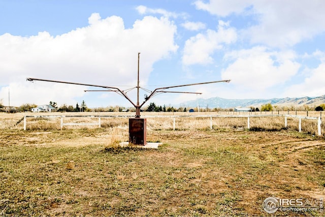 view of yard featuring a mountain view and a rural view