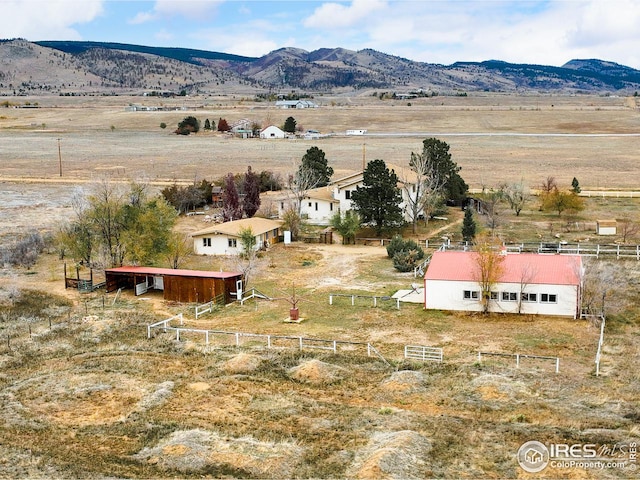 exterior space featuring a rural view and a mountain view