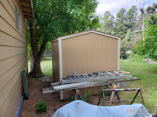 view of outdoor structure with a lawn