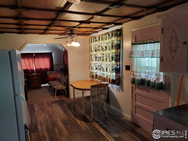 dining space with ceiling fan and hardwood / wood-style flooring