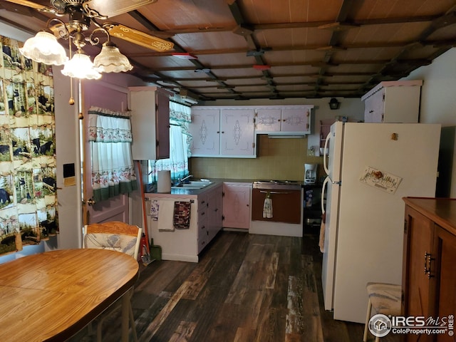 32246 Poudre Canyon Hwy, Bellvue, CO 80512 - kitchen with range with gas cooktop, freestanding refrigerator, dark wood-style flooring, white cabinets, and ceiling fan