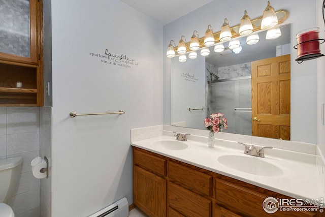 bathroom featuring walk in shower, vanity, and toilet