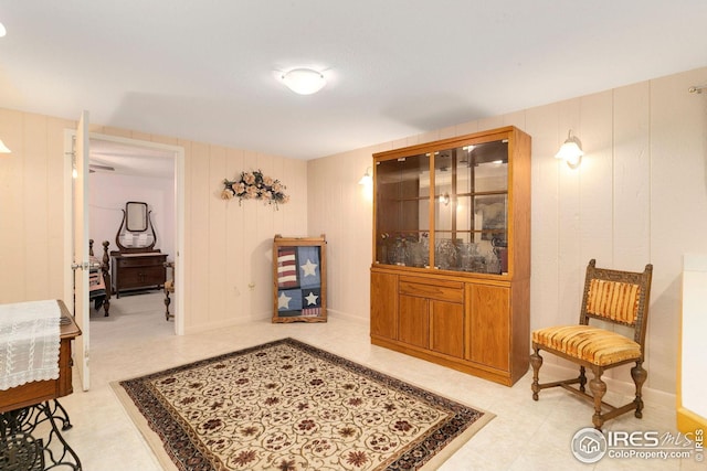 living area featuring wooden walls