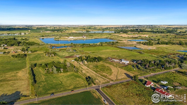 aerial view with a rural view and a water view