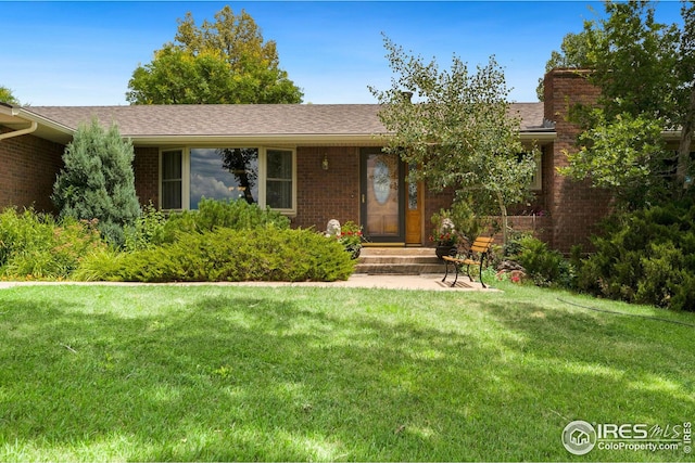 ranch-style home featuring a front yard