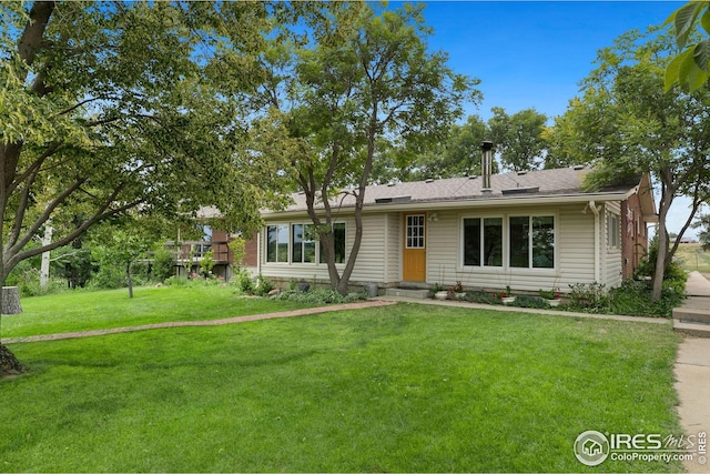 ranch-style home with a front lawn