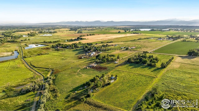 birds eye view of property with a mountain view and a rural view