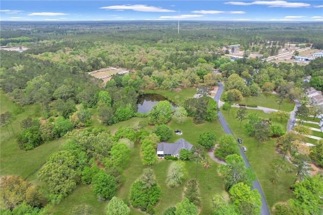 aerial view featuring a view of trees and a water view