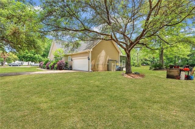 exterior space with a lawn, concrete driveway, and a garage