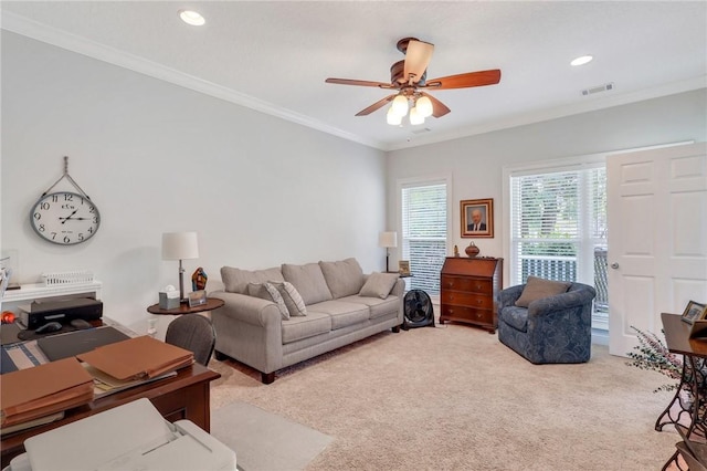 living area featuring a ceiling fan, crown molding, light colored carpet, visible vents, and recessed lighting