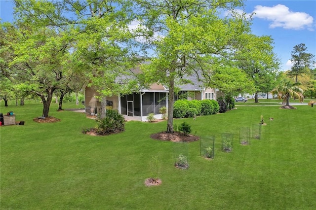 view of yard featuring a sunroom