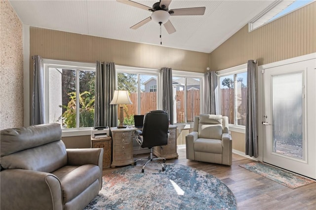 office featuring lofted ceiling, a healthy amount of sunlight, ceiling fan, and wood finished floors