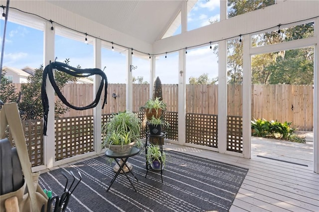 sunroom / solarium with a wealth of natural light and lofted ceiling