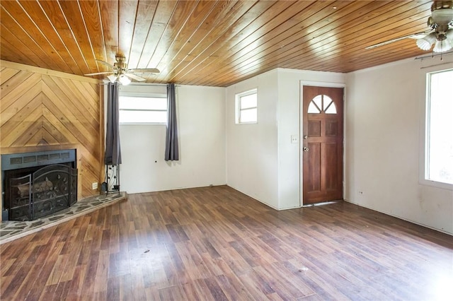 4442 Brunswick Hwy, Waycross, GA 31503 - unfurnished living room featuring a ceiling fan, wood ceiling, a fireplace with raised hearth, and wood finished floors