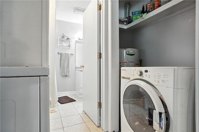 125 Enterprise St, Brunswick, GA 31525 - washroom featuring washer / clothes dryer and light tile patterned floors
