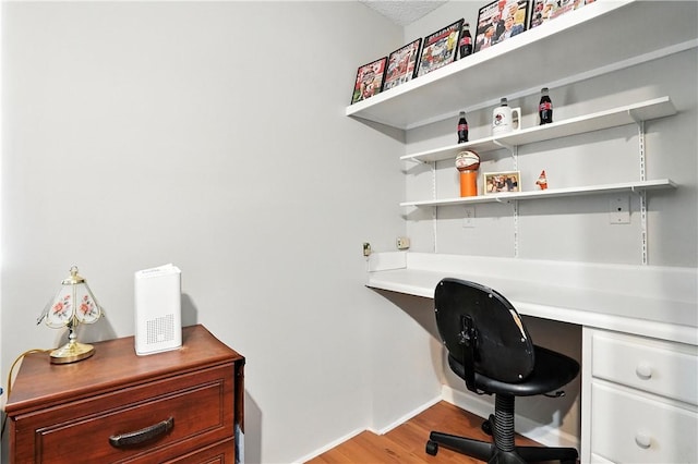 125 Enterprise St, Brunswick, GA 31525 - home office featuring built in desk and light wood-style flooring