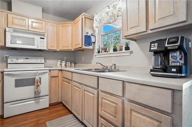 125 Enterprise St, Brunswick, GA 31525 - kitchen with white appliances, light brown cabinets, light wood-type flooring, light countertops, and a textured ceiling