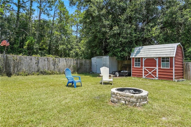 125 Enterprise St, Brunswick, GA 31525 - fenced backyard with a shed and a fire pit