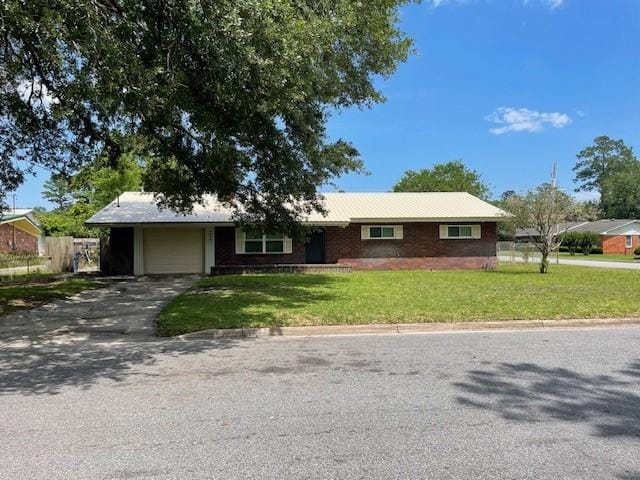 3204 Dogwood Ave, Brunswick, GA 31520 - ranch-style home with a garage and asphalt driveway