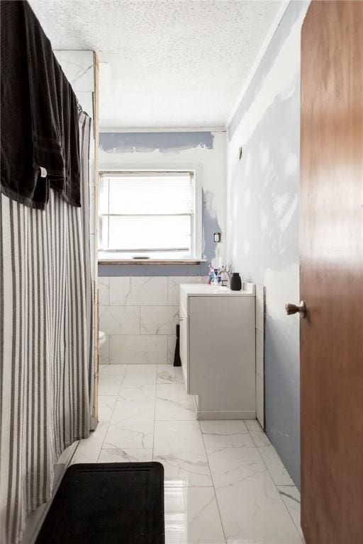300 Community Dr, Waycross, GA 31501 - bathroom with vanity, toilet, marble finish flooring, a textured ceiling, and curtained shower