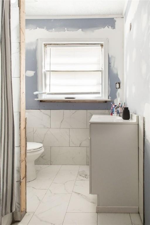 300 Community Dr, Waycross, GA 31501 - bathroom featuring toilet, plenty of natural light, crown molding, and vanity