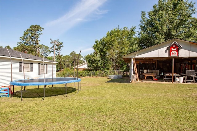 300 Community Dr, Waycross, GA 31501 - view of grassy yard featuring a trampoline