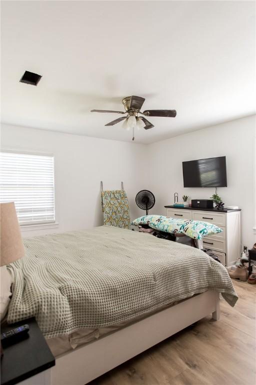 300 Community Dr, Waycross, GA 31501 - bedroom with light wood-style floors and a ceiling fan