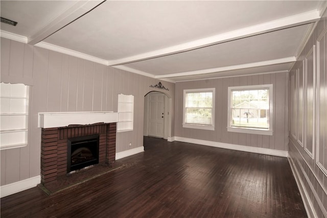 2108 Darling Ave, Waycross, GA 31501 - unfurnished living room with beamed ceiling, dark wood-style flooring, a fireplace, baseboards, and crown molding