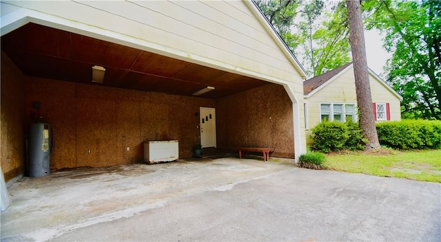 2108 Darling Ave, Waycross, GA 31501 - doorway to property featuring water heater and a carport