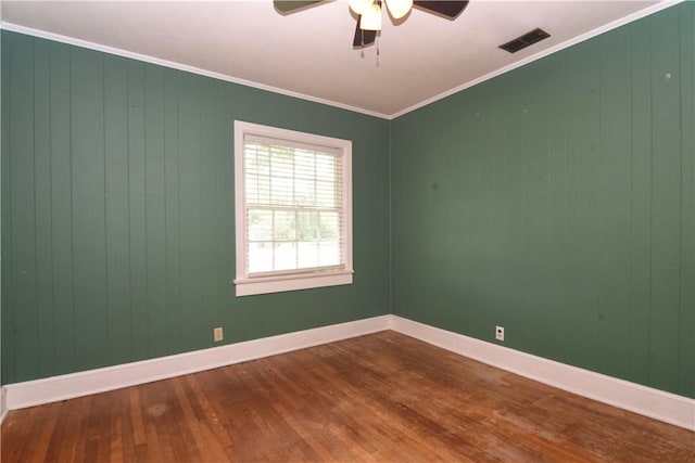 2108 Darling Ave, Waycross, GA 31501 - unfurnished room featuring wood finished floors, ceiling fan, baseboards, and ornamental molding