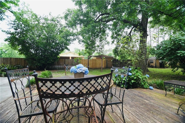2108 Darling Ave, Waycross, GA 31501 - wooden terrace with outdoor dining space and a fenced backyard