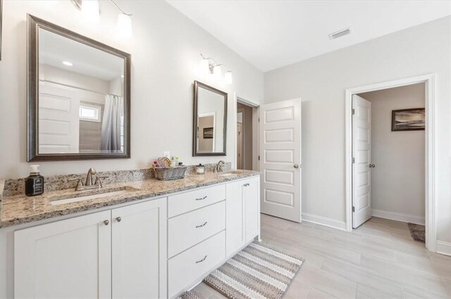139 Allie Loop, Brunswick, GA 31525 - full bathroom with double vanity and baseboards