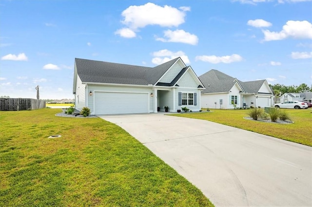 139 Allie Loop, Brunswick, GA 31525 - view of front facade featuring concrete driveway, an attached garage, and a front yard