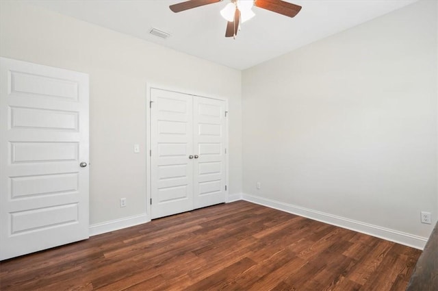 139 Allie Loop, Brunswick, GA 31525 - unfurnished bedroom with dark wood-style flooring, a closet, and a ceiling fan