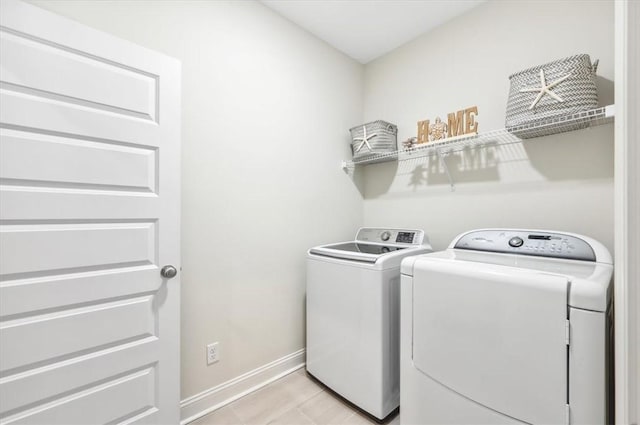 139 Allie Loop, Brunswick, GA 31525 - laundry area featuring washing machine and clothes dryer and baseboards