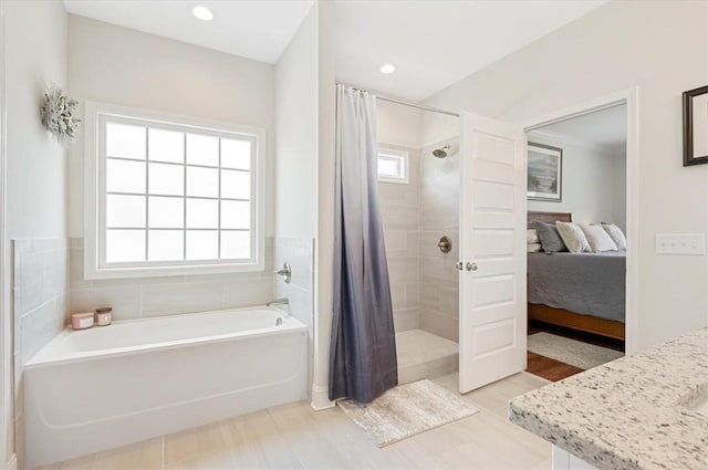 139 Allie Loop, Brunswick, GA 31525 - ensuite bathroom with a bath, a tile shower, vanity, and recessed lighting