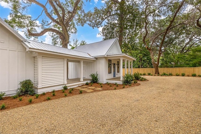 247 Circle Dr, Saint Simons Island, GA 31522 - modern inspired farmhouse featuring metal roof, a porch, and board and batten siding