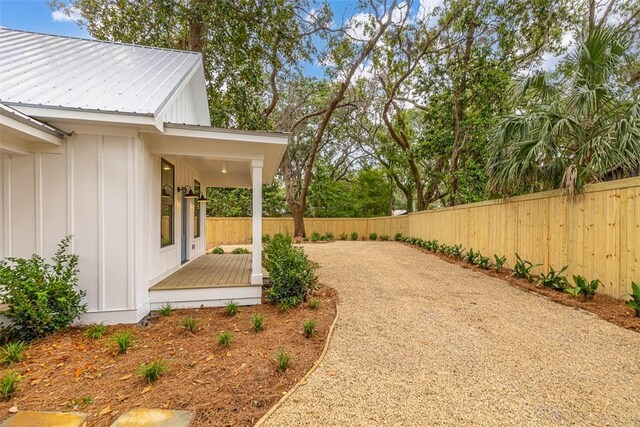 247 Circle Dr, Saint Simons Island, GA 31522 - view of property exterior with metal roof