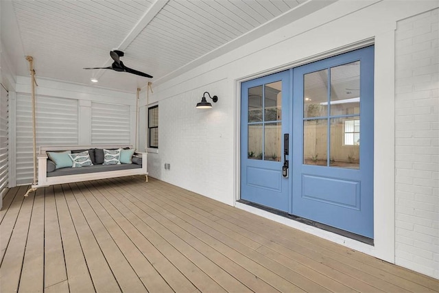 247 Circle Dr, Saint Simons Island, GA 31522 - wooden deck featuring french doors and ceiling fan