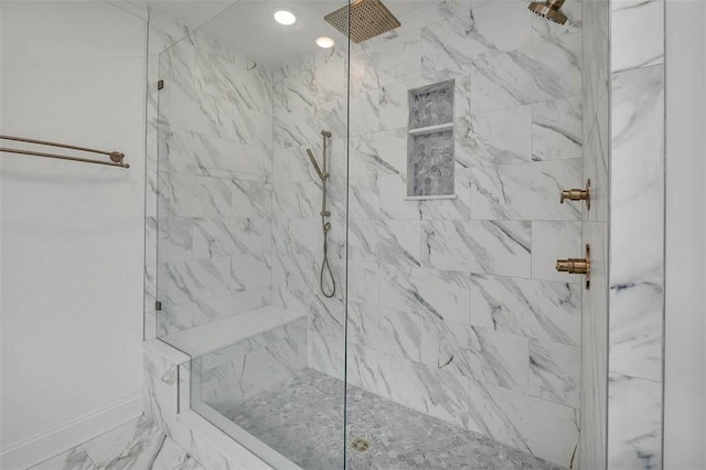 247 Circle Dr, Saint Simons Island, GA 31522 - bathroom with a tile shower, baseboards, and marble finish flooring