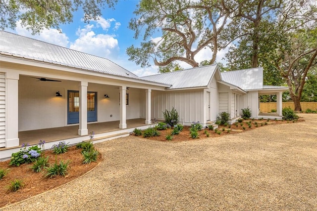 247 Circle Dr, Saint Simons Island, GA 31522 - view of front of home with a porch, metal roof, board and batten siding, and ceiling fan